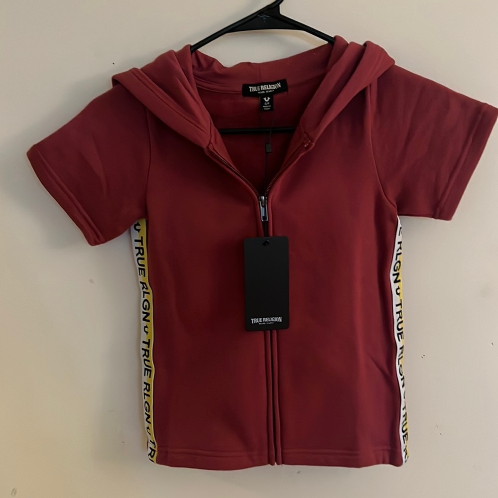 Brand new True Religion kids short sleeve zip up/skirt set.